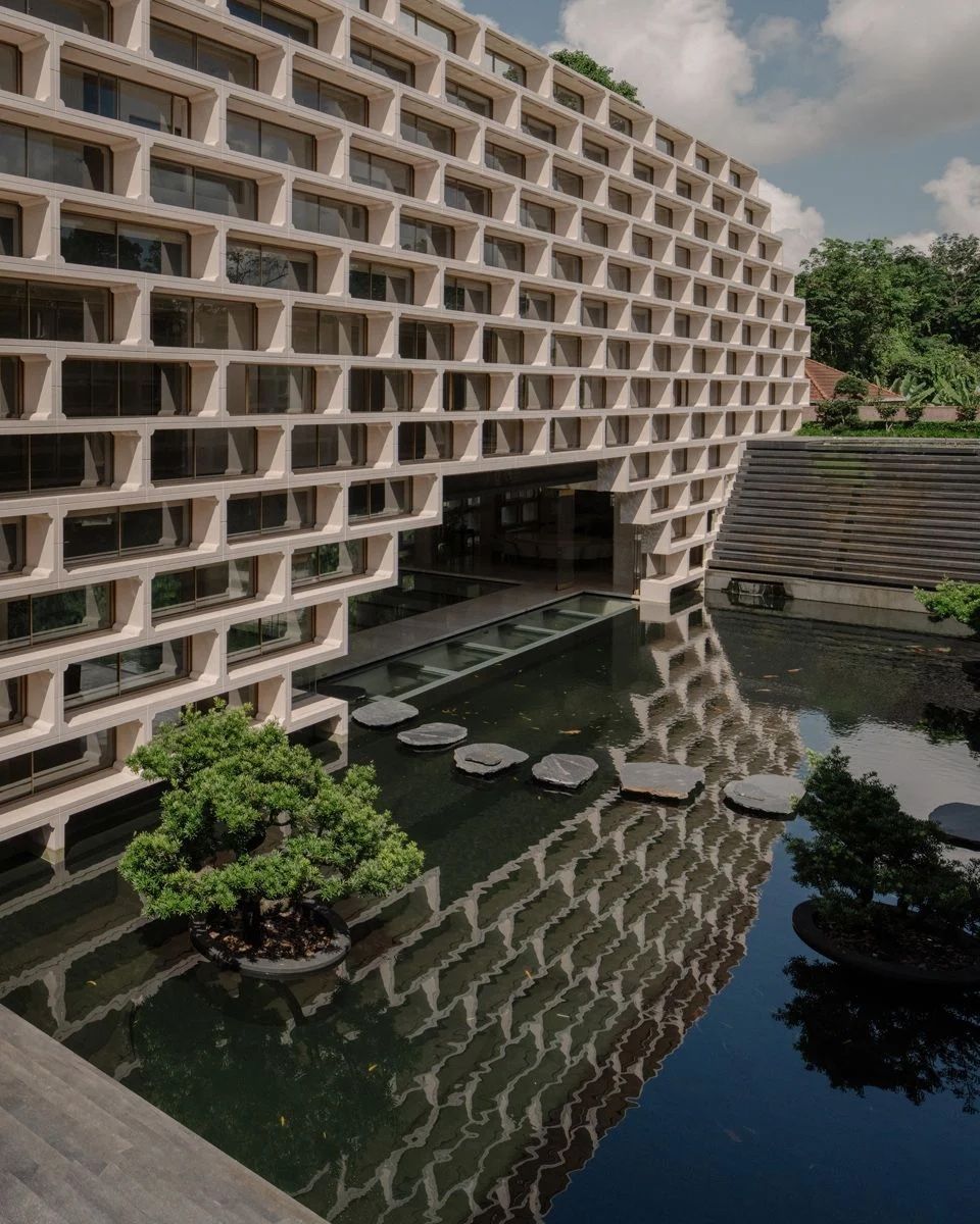A view of the two-storey rear block of the Moongate House from the cascading water feature, the opening of the block is a nod to the traditional Chinese moon gate, which forms a “full moon” via the reflection in the water below