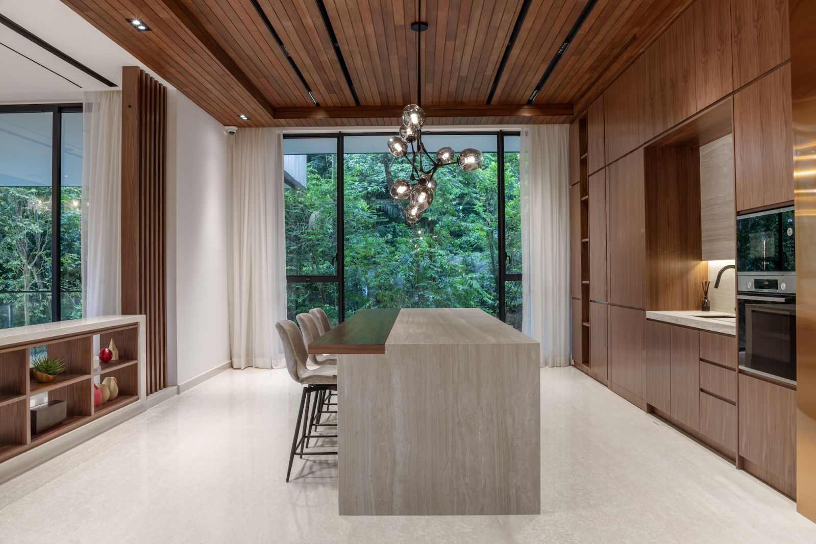 The ground floor was designed as the heart of the home, seamlessly integrating the living, dining, and kitchen areas for fluid movement