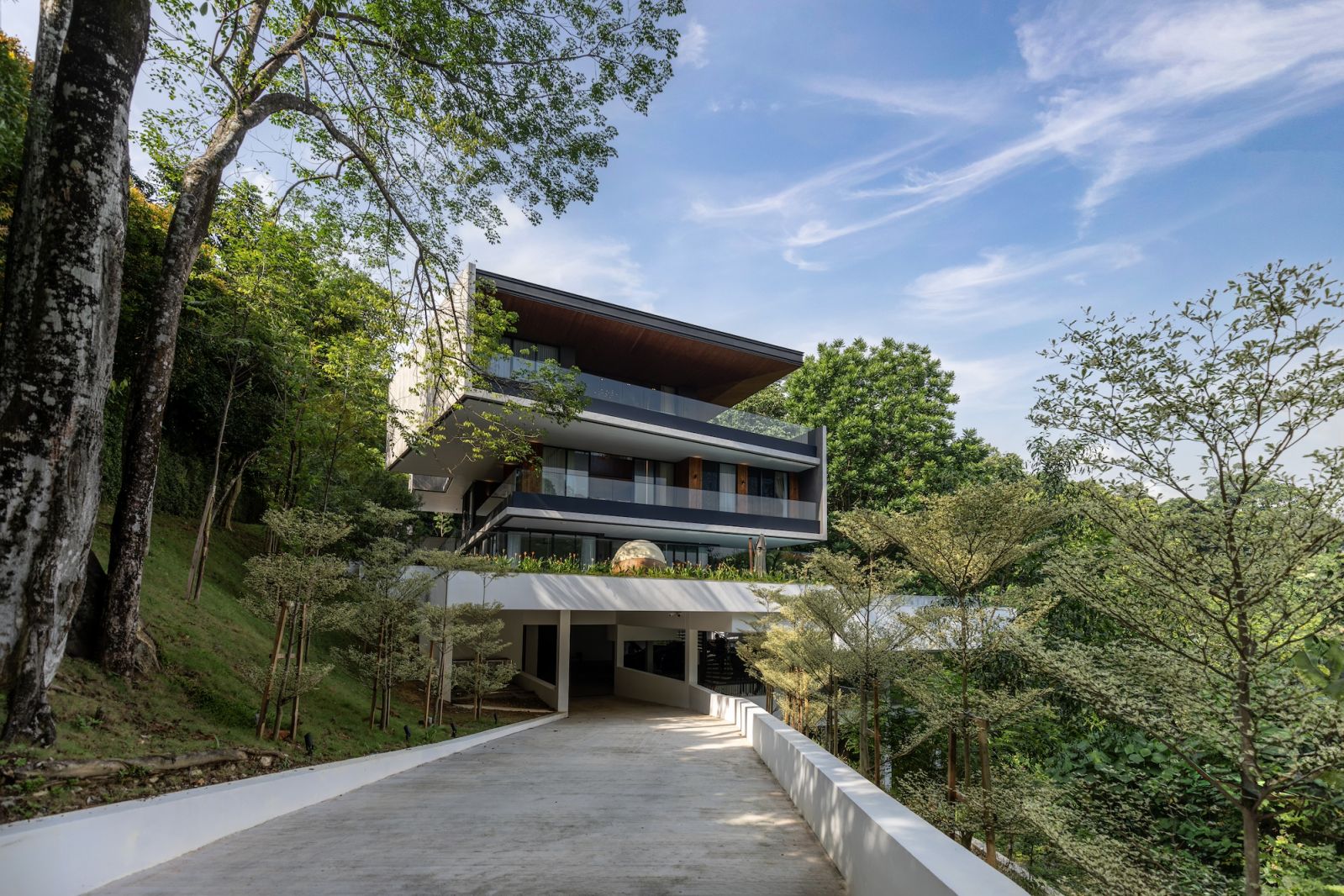 The striking exterior of Max House showcases DCA+ architects’ modernist design with overlapping concrete planes and warm Thermopine cladding
