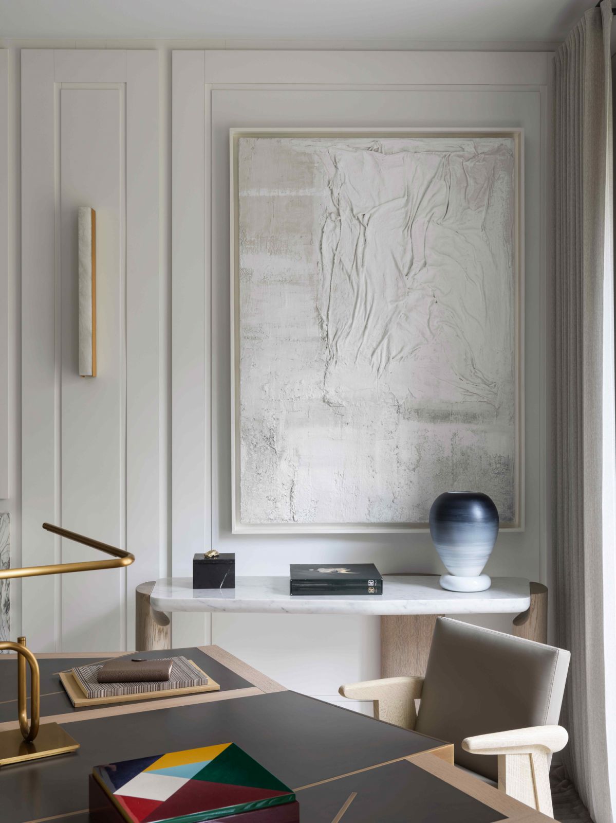 A Sand Breton artwork above a LOB by Collection Particulière console table