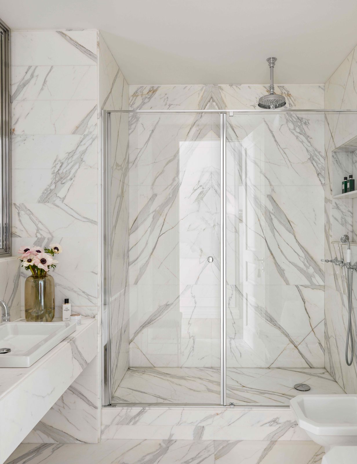 The master bathroom furnished in natural marble