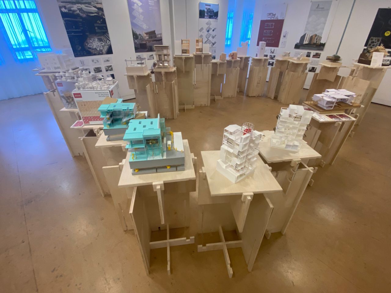 Sectional models illustrate the exhibition's concept of transforming architectural models into “dynamic instruments that connect conceptual ideas with tangible architectural expression” through strategic cuts that reveal spatial relationships.