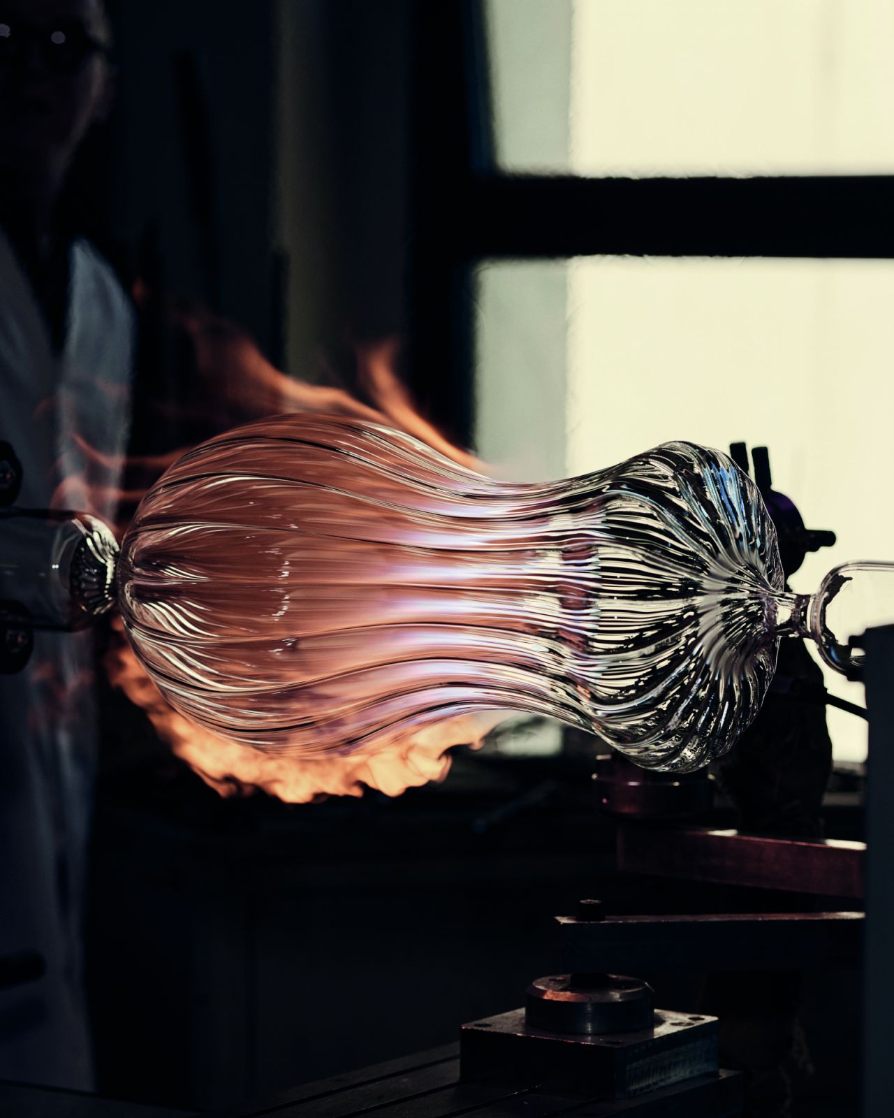 The firing of a glass vessel at the artisan’s hot shop