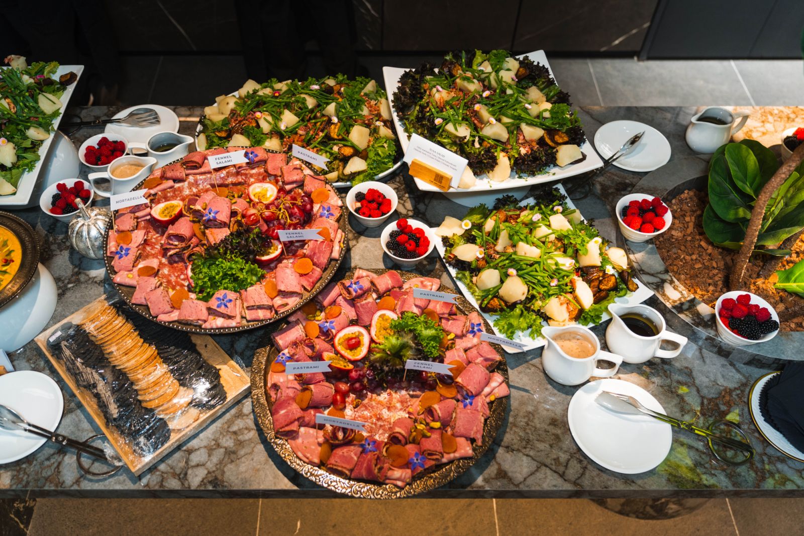 A rich selection of cold cuts and tuna salad with akami tataki, chu-toro, katsuobushi, haricots verts, Dutch cream potato and wasabi arugula