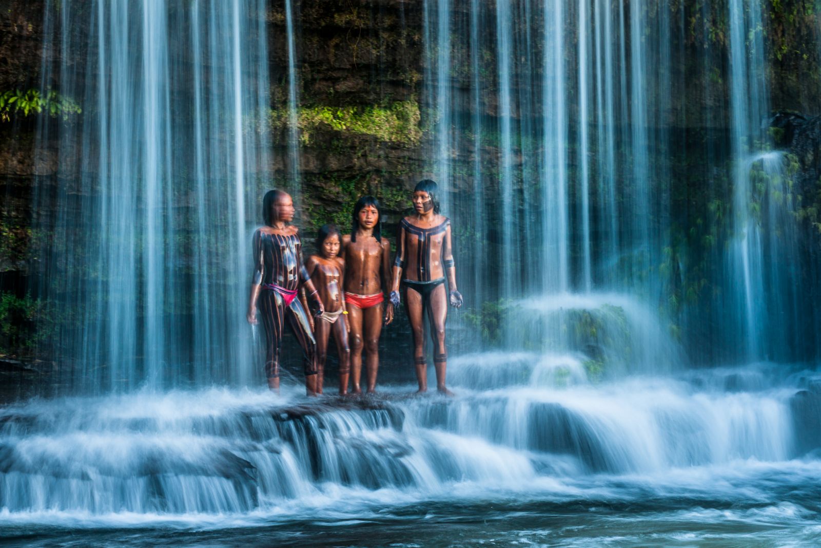 Cristina Mittermeier’s photographs often show the beautiful relationship between people and nature, like these Kayapo girls seen playing under a waterfall. The Kayapo people are one of the countless indigenous tribes of the Amazon Rainforest.