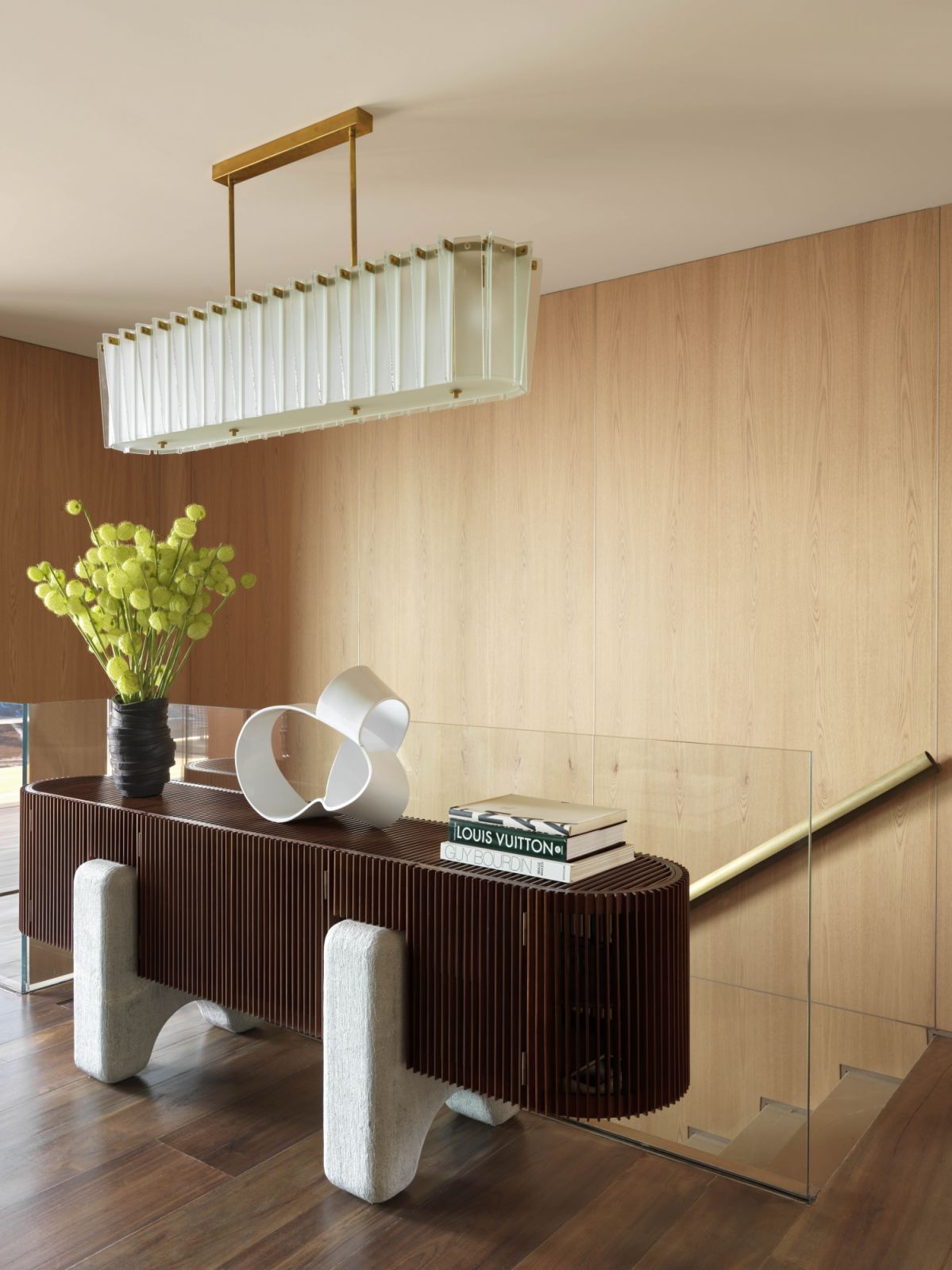 On the landing, a Tomie Ohtake sculpture from Carbono tops the Ripas credenza by the Campana brothers