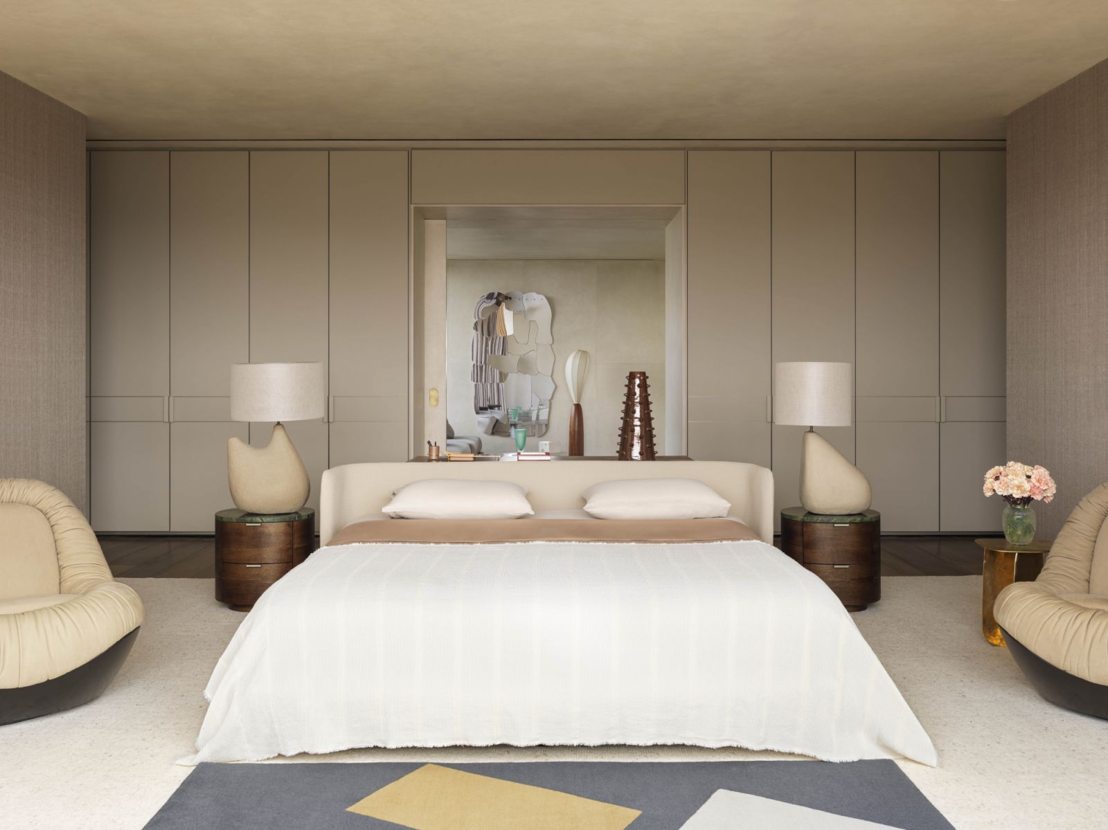 The master bedroom incorporates plush Baxter Barret armchairs and bespoke tables by Gomide & Marzano