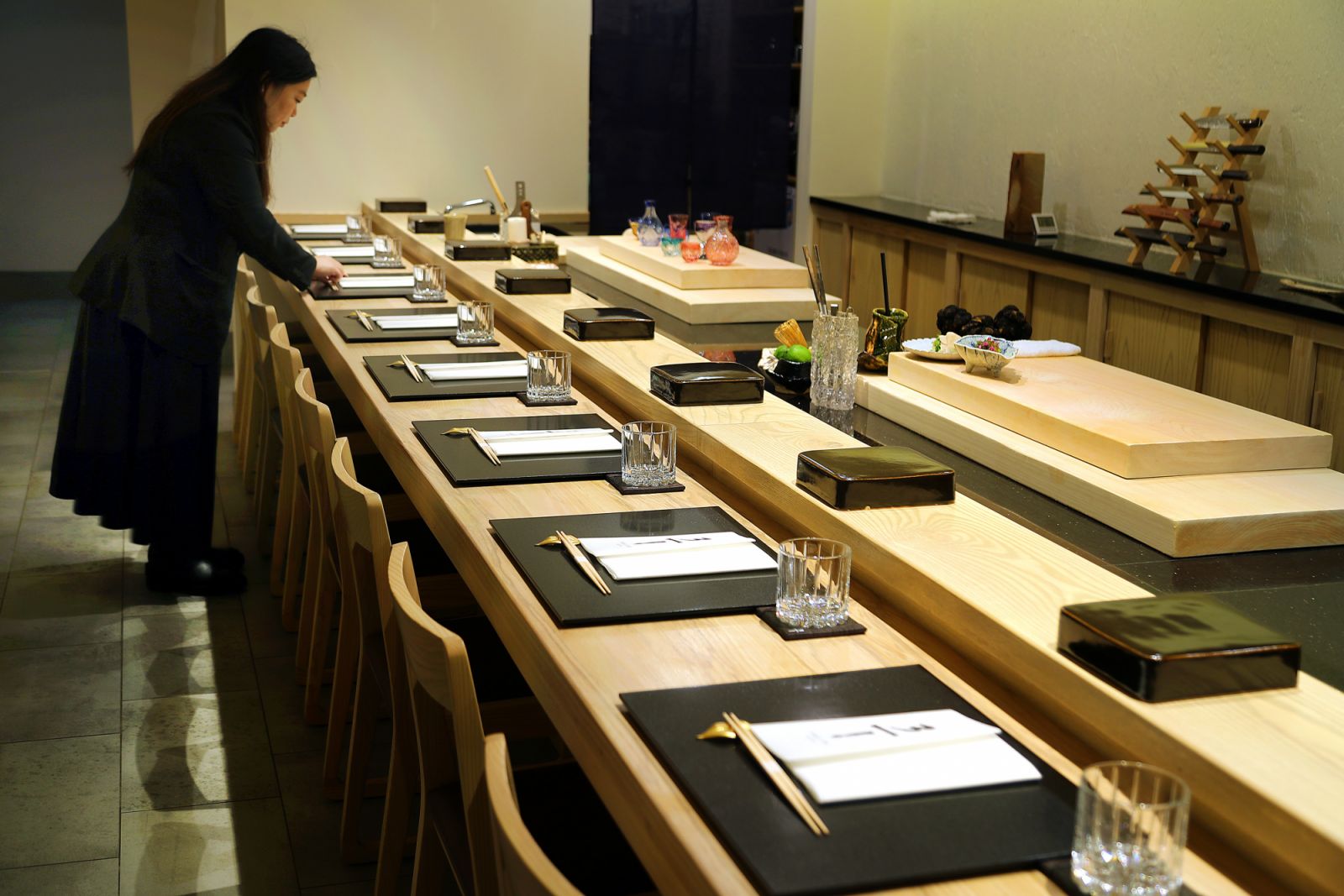 Boston, MA - May 23: 311 Omakase Manager Carrie Ko arranges a table. (Photo by John Tlumacki/The Boston Globe via Getty Images)