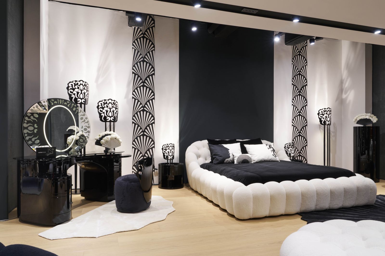 A black-and-white bedroom featuring the Bubble bed—reimagined by Rossy de Palma—brings bold contrast and surrealist charm to the Roche Bobois showroom
