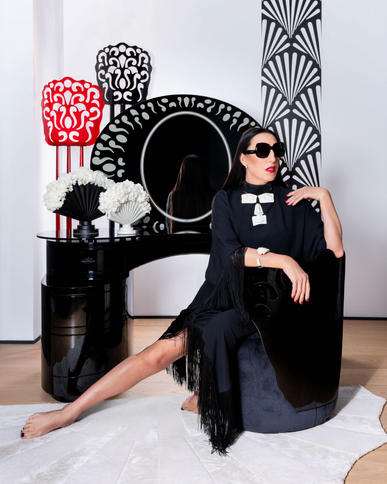 Rossy de Palma, actress and long-time muse of Pedro Almodóvar, brought her signature surrealist flair to the collaboration with a capsule of bold, symbolic designs