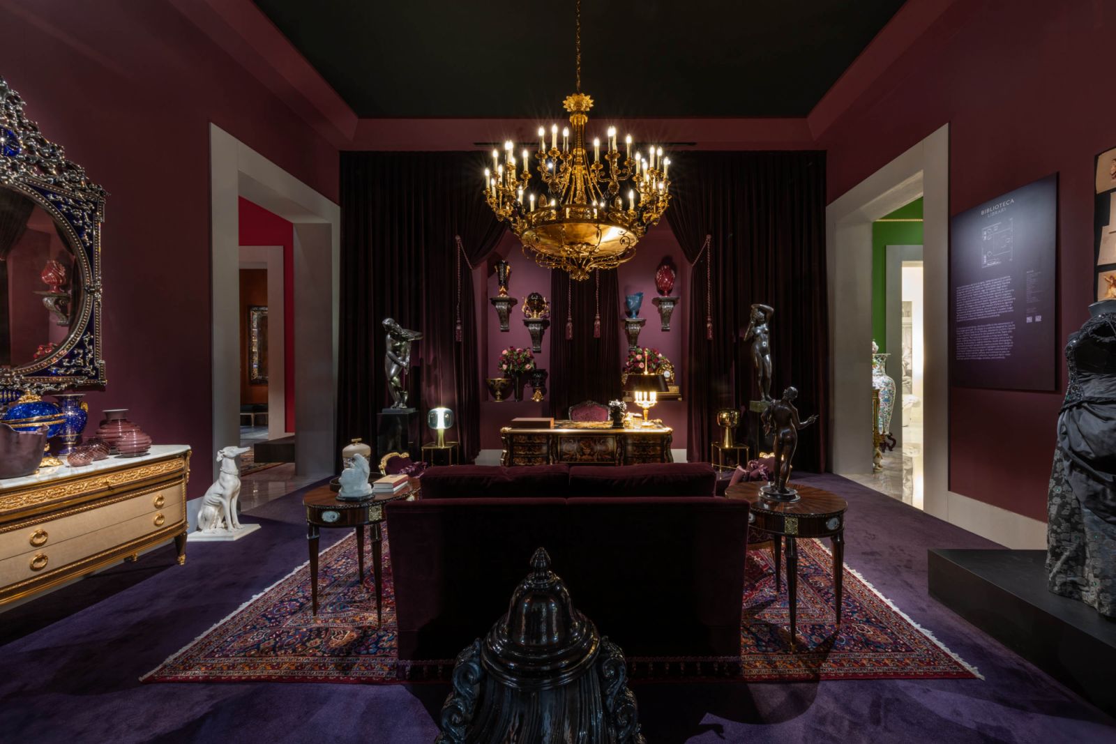 The plum-hued library at “Villa Heritage” during Salone del Mobile offered a moody, regal retreat