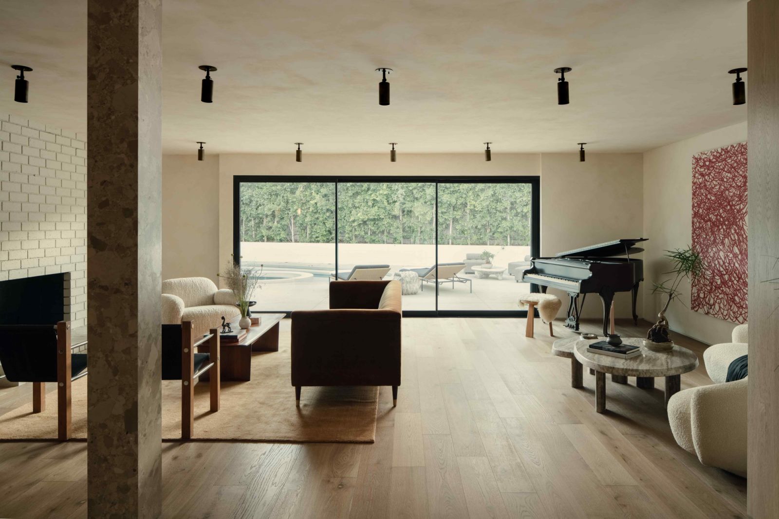 Natural light streaming through sliding glass doors into the formal living room