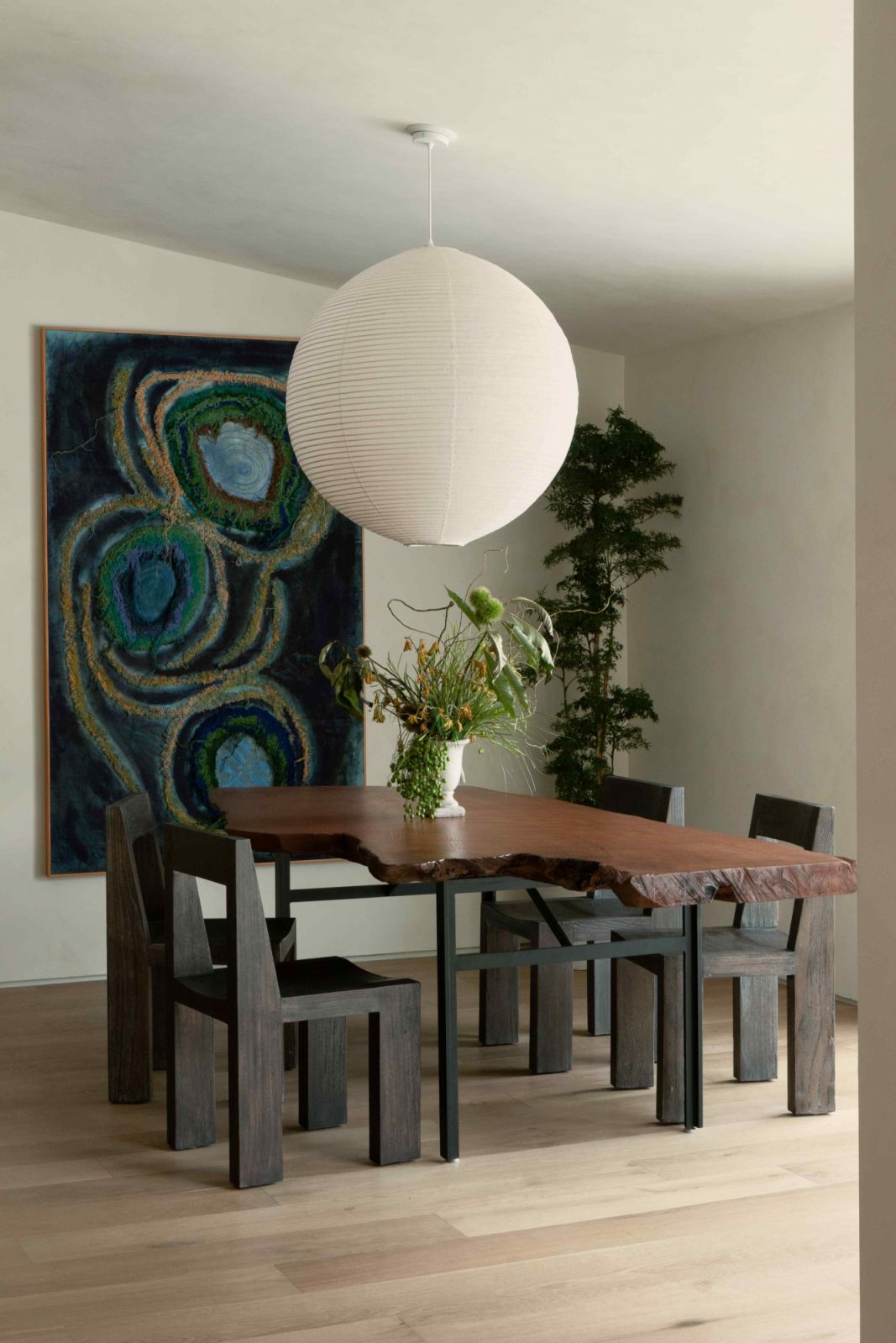 A Noguchi Japanese lantern above the wooden dining table