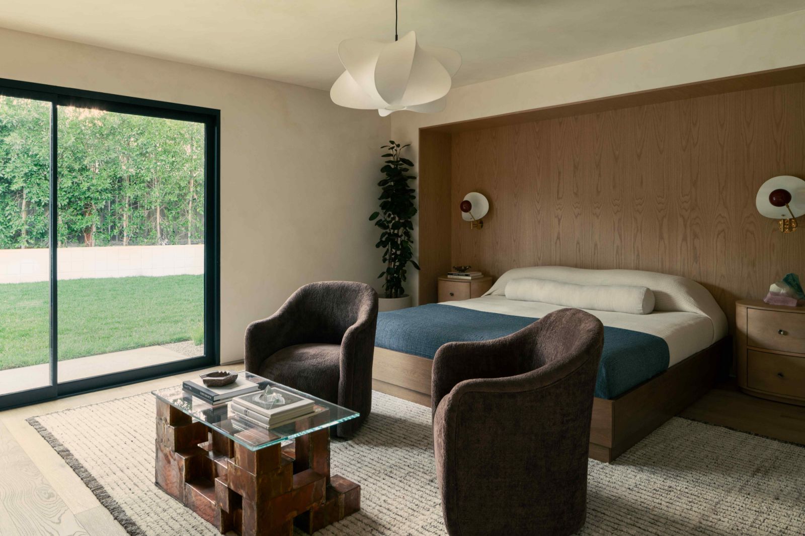 The serene ambiance extends into the primary suite
