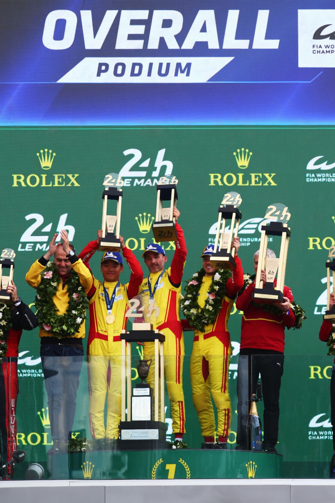 LE MANS, FRANCE - JUNE 15: Yifei Ye of China (2nd left) Phil Hanson of Great Britain (2nd right) and Robert Kubica of Poland (centre) celebrate winning in their #83 AF Corse Ferrari 499P during the 24 Hours of Le Mans at the Circuit de la Sarthe on June 15, 2025 in Le Mans, France. (Photo:Getty Images)