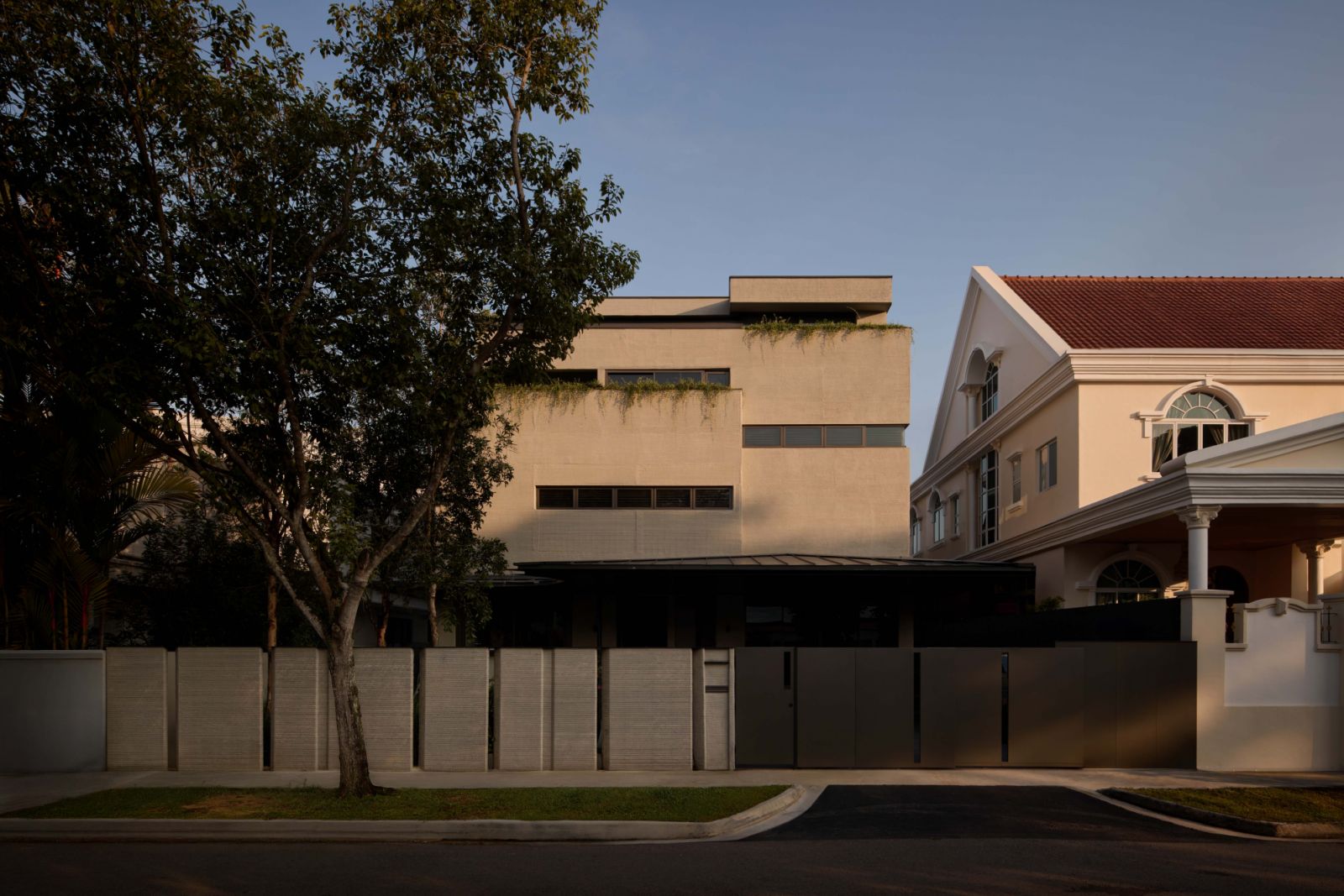 Set within a typical Bukit Timah neighbourhood, the 3D-printed house stands apart with its monolithic, layered concrete façade—an architectural first in Singapore realised with CES_InnovFab