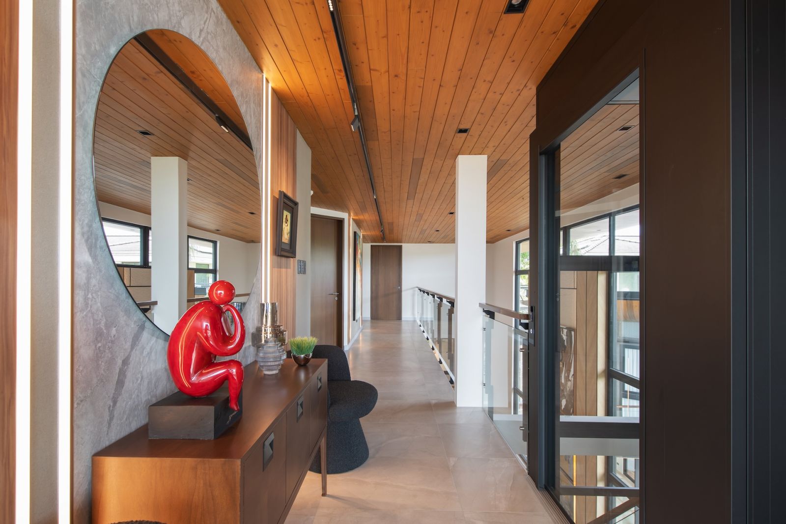The art-filled hallway of this Alabang, Metro Manila home designed by Rock Robins