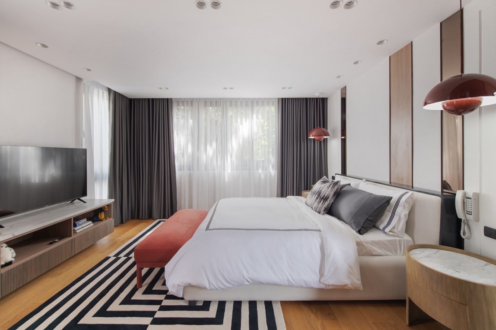 One of the bedrooms in this Alabang, Metro Manila home designed by Rock Robins