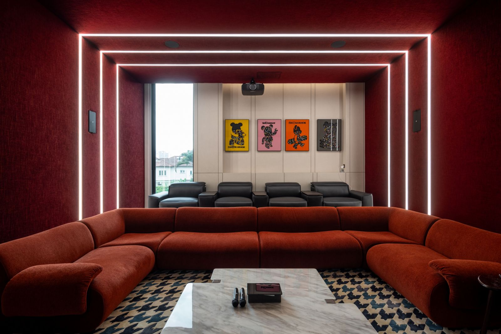 Bold red  and strategic lighting were chosen for this memorable AV room