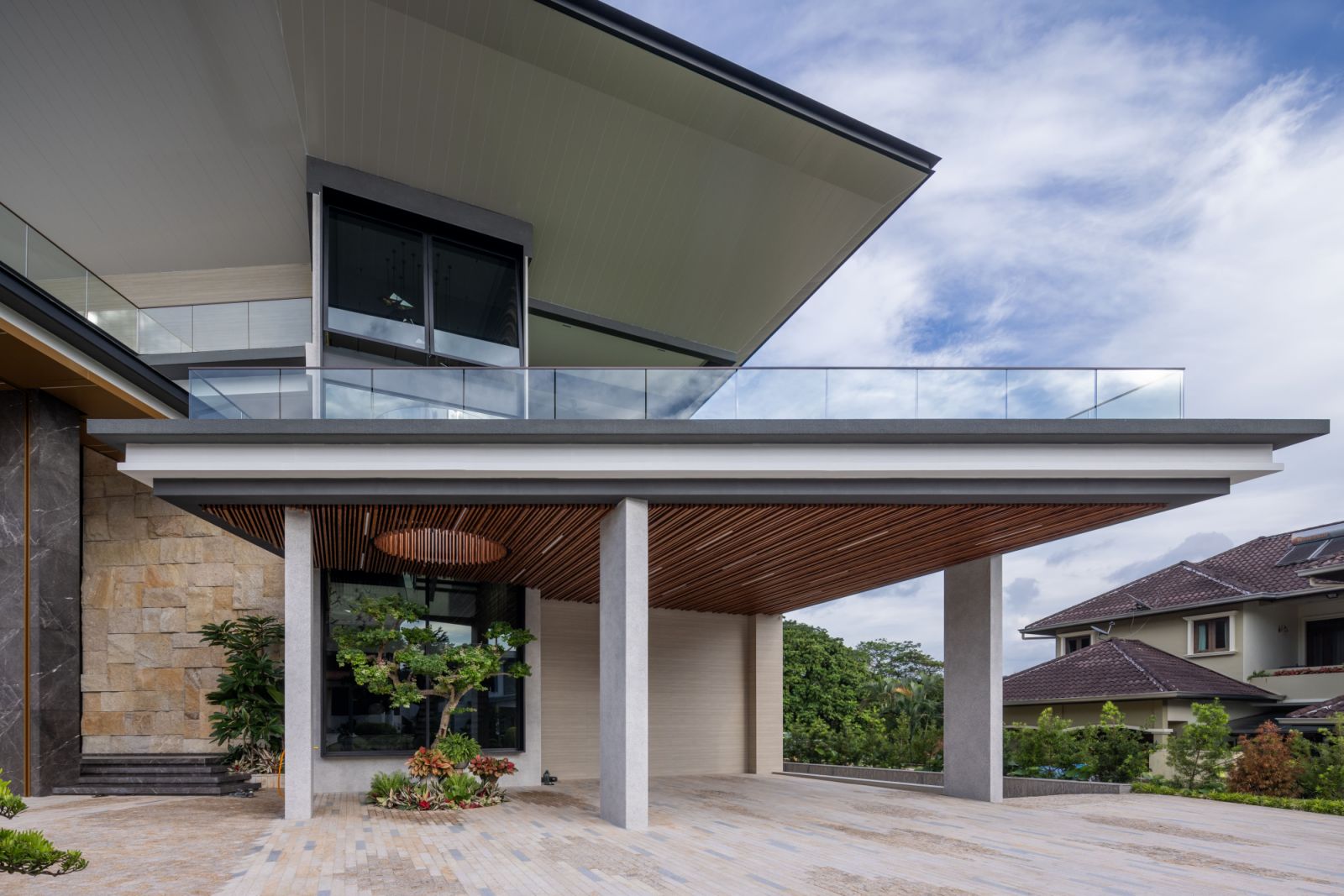 The porch makes a bold architectural statement with its soaring  3.8-meter entrance door