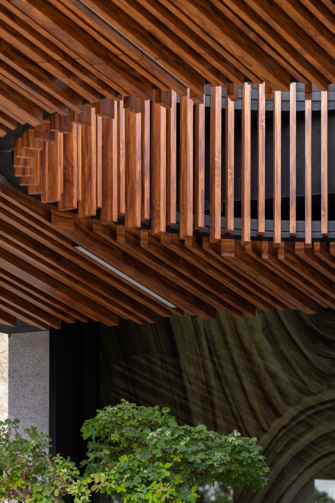 Asymmetrical roof planes provide shelter and visual intrigue