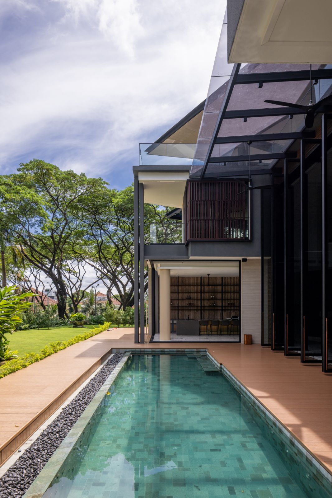 The meticulously designed pool area forms a centerpiece of outdoor living in this home