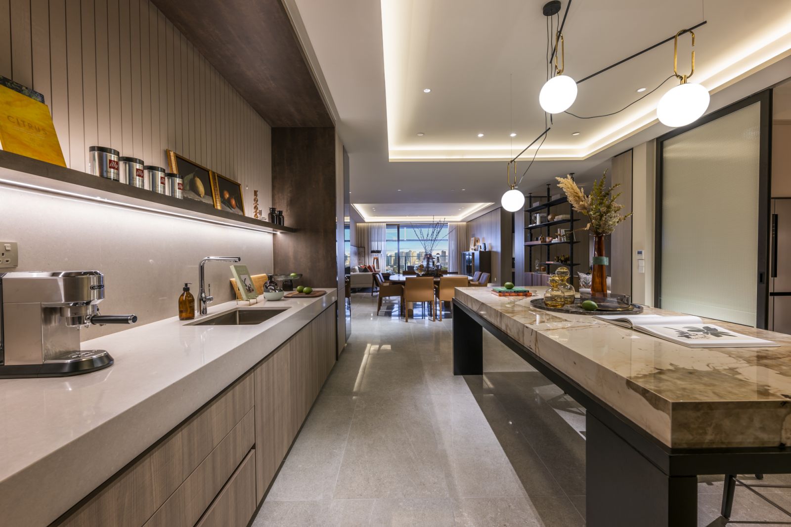 Main kitchen with connection to naturally lit yard, designed for everyday cooking and connected to back-of-house areas and the maid’s quarters
