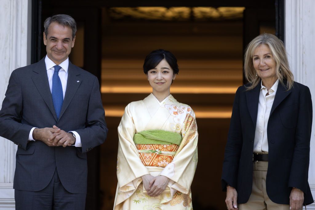 ATHENS, GREECE - MAY 28: Greek Prime Minister Kyriakos Mitsotakis (R) and his wife Mareva Grabowski (L) welcome the Japan's Princess Kako (C) at the Maximos Mansion in Athens, Greece on May 28, 2024. (Photo by Costas Baltas/Anadolu via Getty Images)