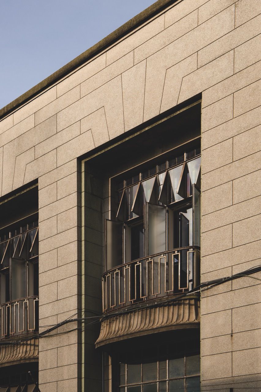 Original window details and structural elements are complemented by a restrained material palette of whitewashed timber, patinated wood, and stone (Photo: TWJPTO)