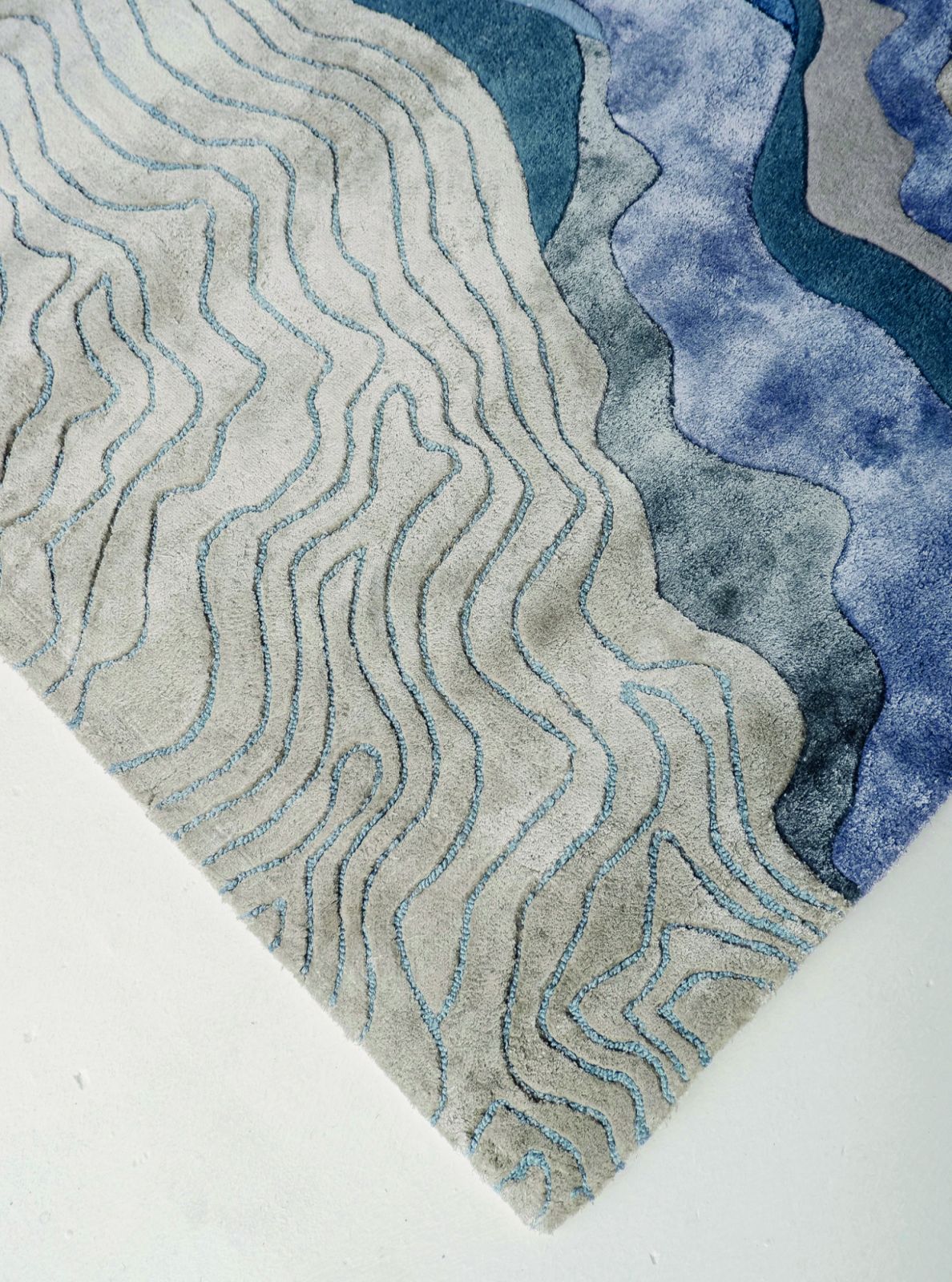 The Flux Sapphire Rug, made with Tencel and New Zealand wool