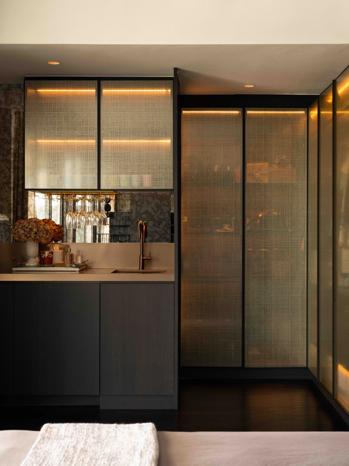 Subtly lit textured surfaces elevate this corner
