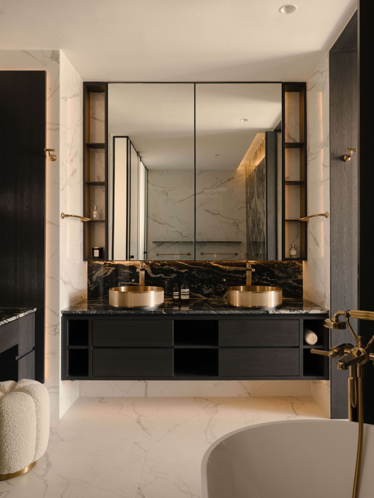 The master bathroom features a double vanity and a black-and-white material palette
