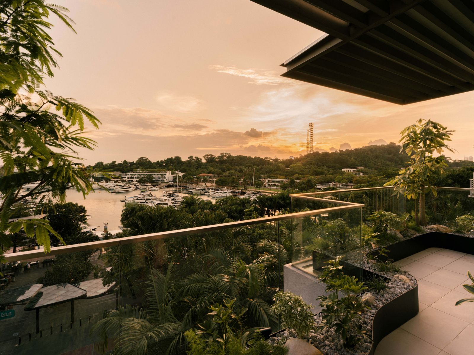 The view of the bustling Sentosa Cove waterfront from the penthouse