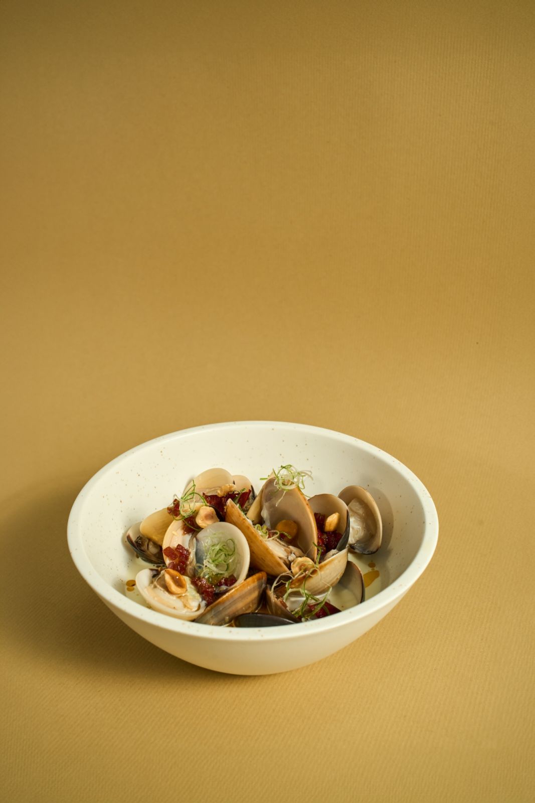 Velvety coconut clam chowder flavoured with roasted chorizo and smoked paprika (Photo: Side Door) tanjong pagar food guide
