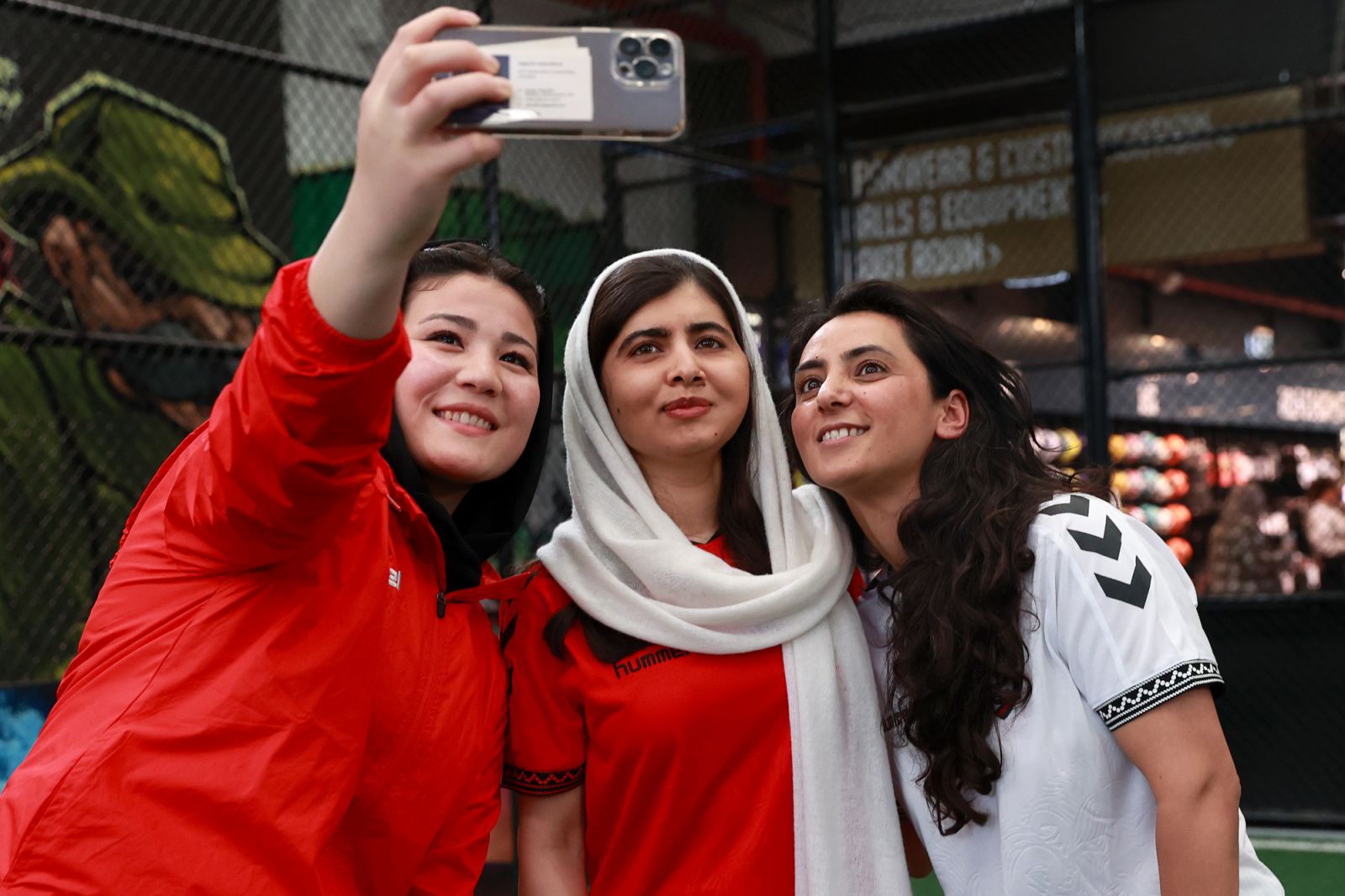 Malala Yousafzai and the Afghan women's soccer team in August 2023 (Photo: Getty Images)