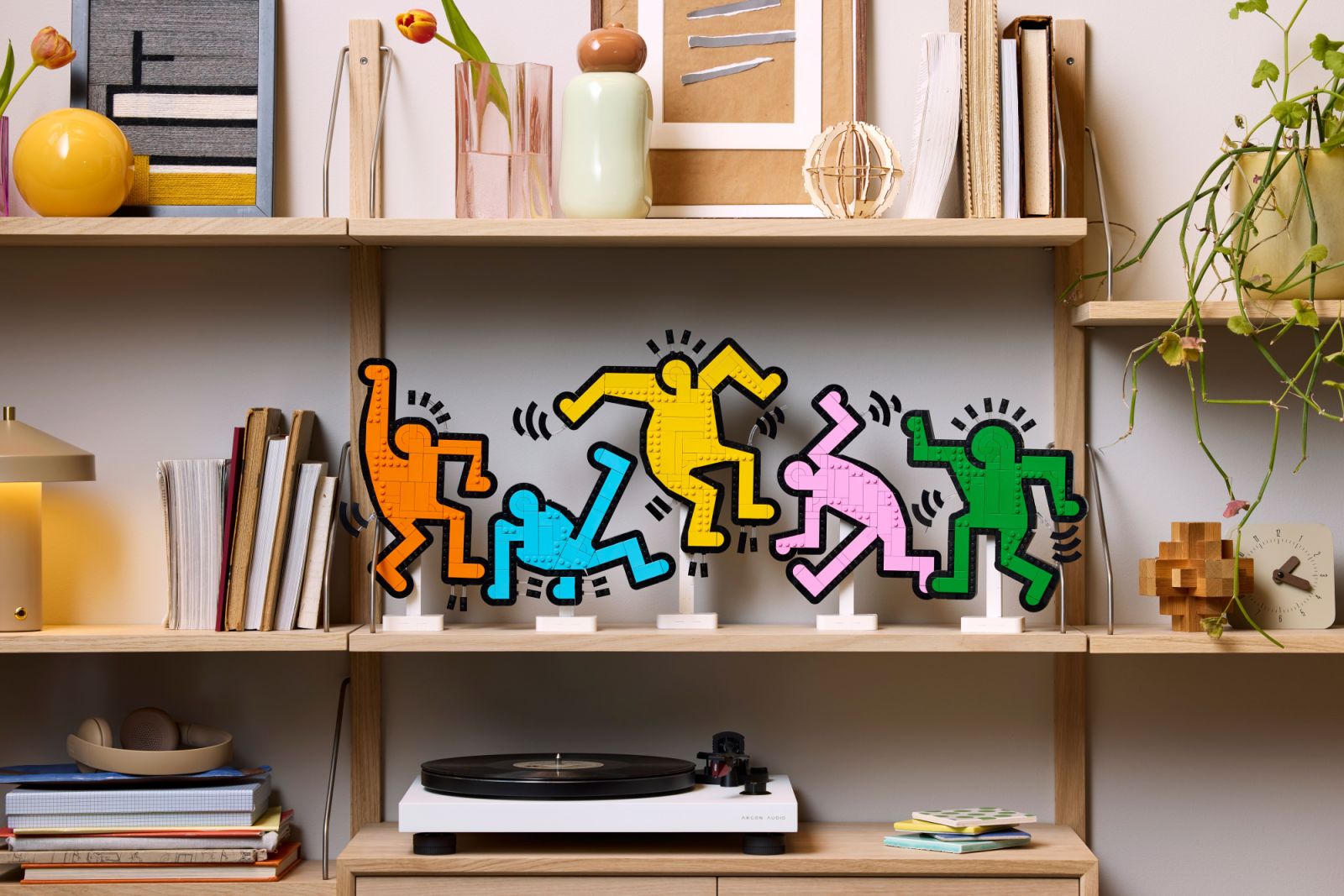 The Lego Art Keith Haring Dancing Figures set showcases the iconic pop art figures in vibrant colours. The 1,773-piece set captures Haring’s signature style with bold, graphic representations of his dancing figures in vibrant colours, including orange, blue, yellow, pink, and green