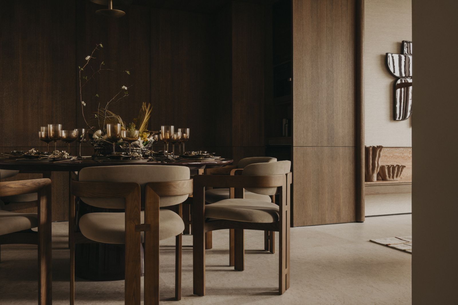 The design focuses on simplicity, seamless flow, and material quality