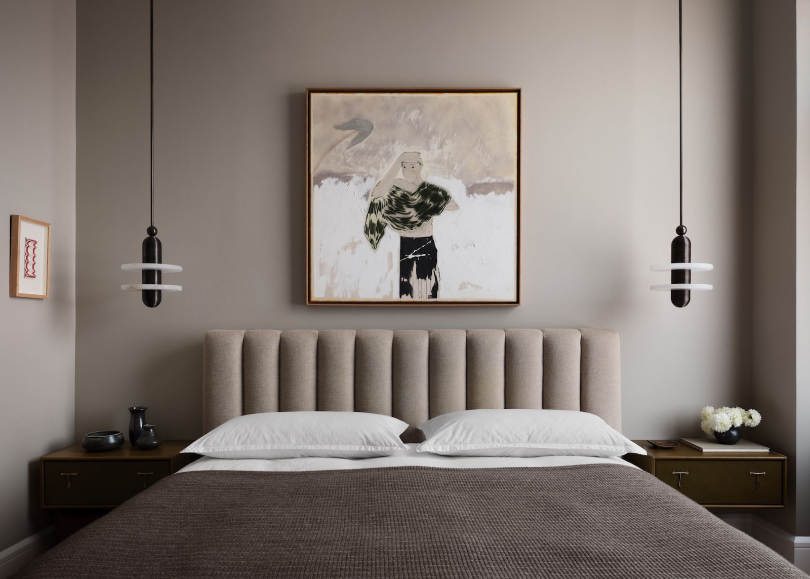 The primary bedroom of a restored warehouse in the West Village, Manhattan, New York; the home was designed by Grisoro Studio