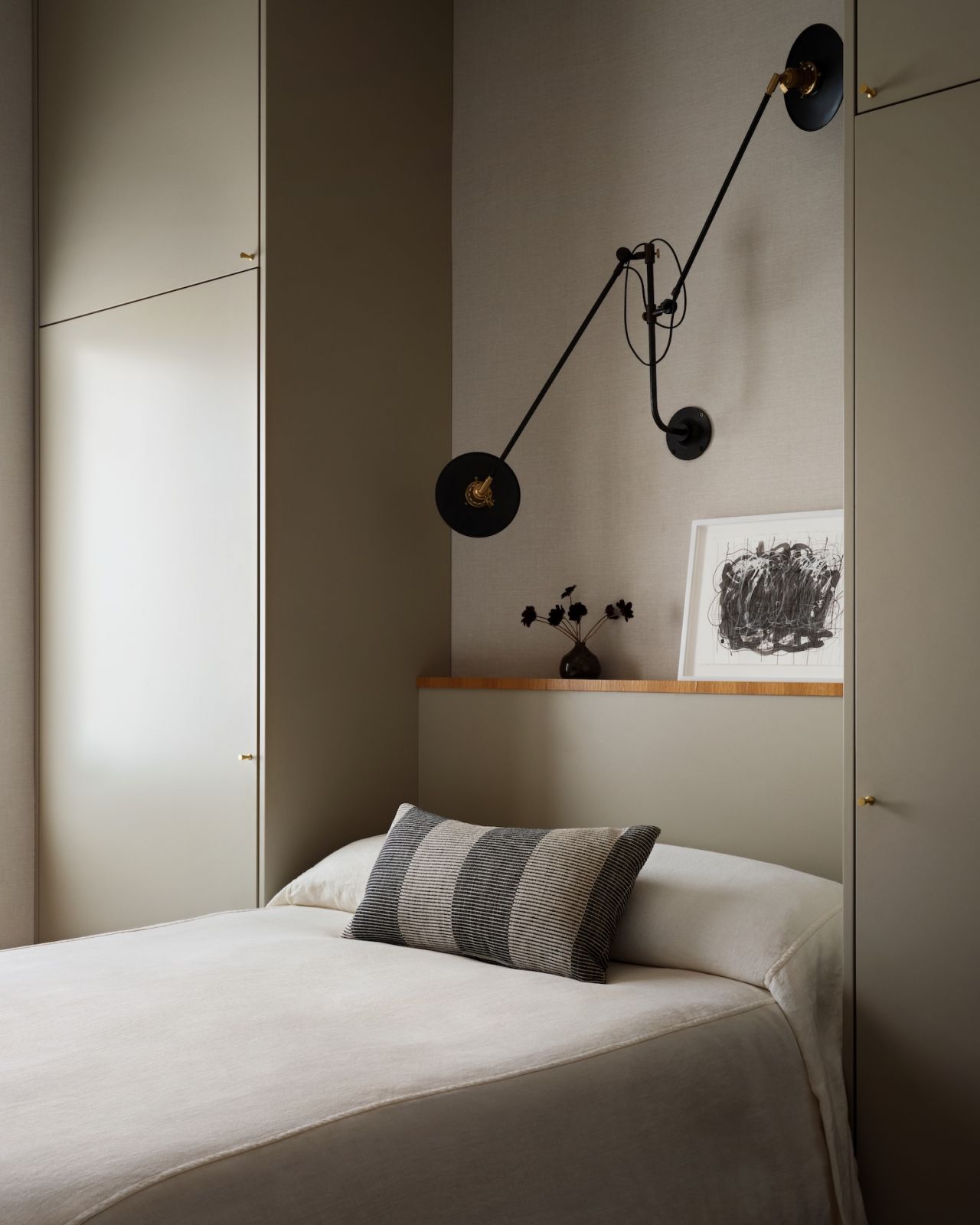 The guest bedroom in a restored warehouse in the West Village, Manhattan, New York designed by Grisoro Studio