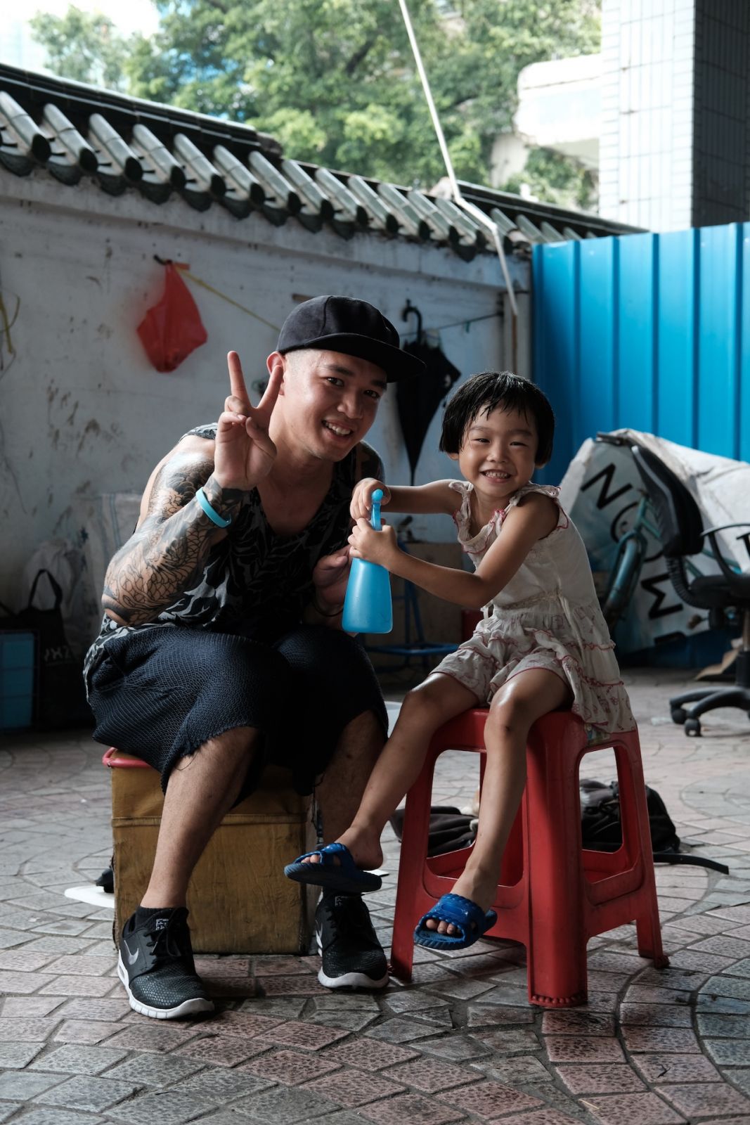 Hairstylist Mark Bustos giving a haircut to a child