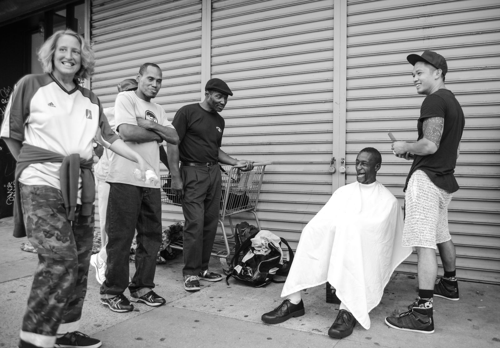 Hairstylist Mark Bustos giving out free haircuts on the streets of New York