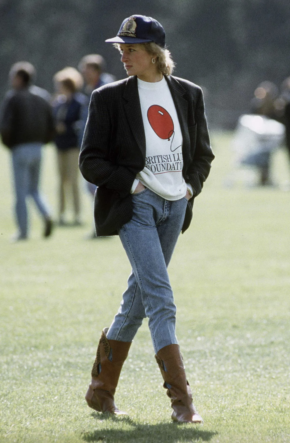 Diana, Princess of Wales wears a Turnbull & Asser checked blazer over a British Lung Foundation sweater, paired with cowboy boots and a baseball cap (Photo: Getty Images)