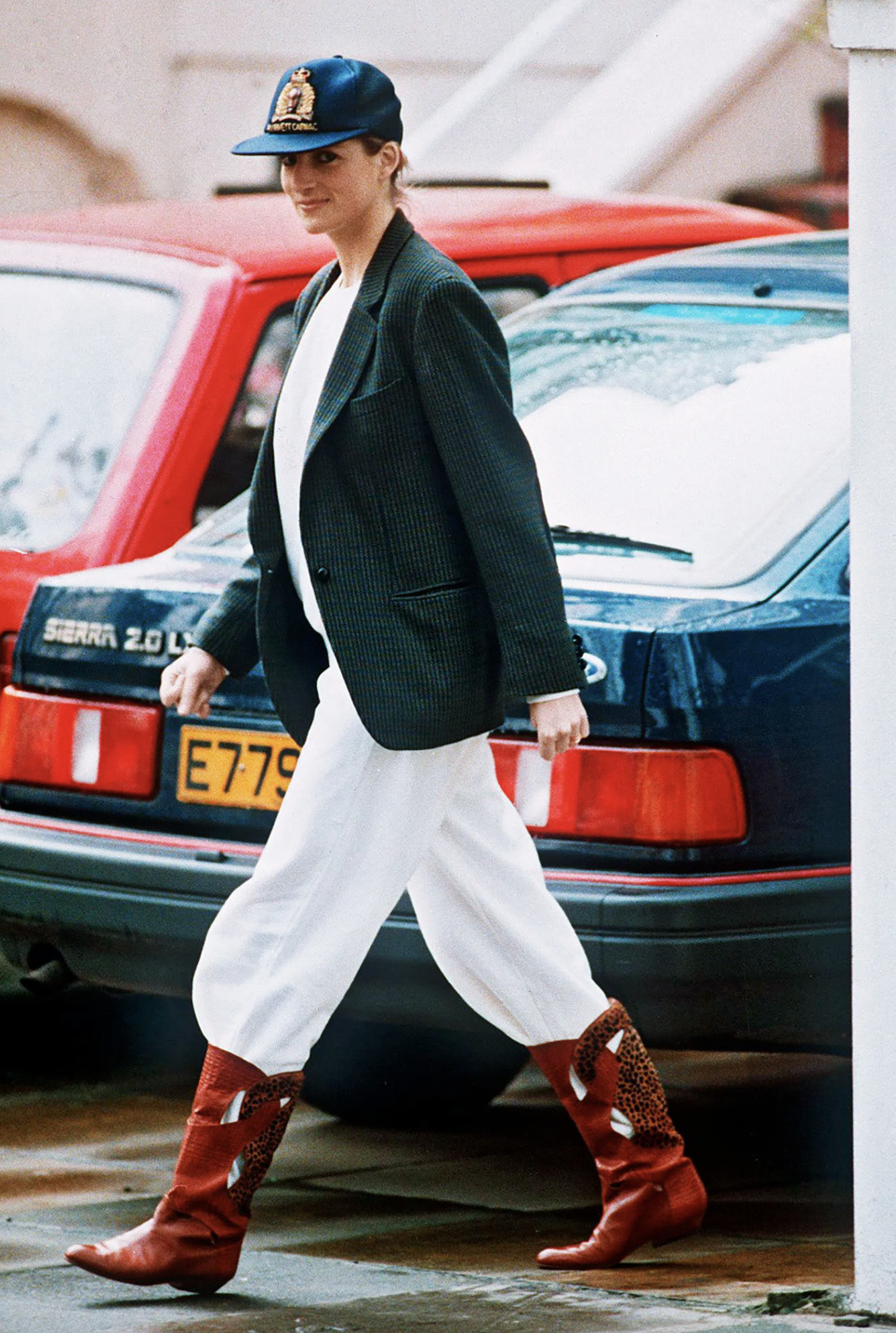 Diana, Princess of Wales wears a Turnbull & Asser checked blazer over a white shirt, balloon pants and a pair of red cowboy boots (Photo: Getty Images)