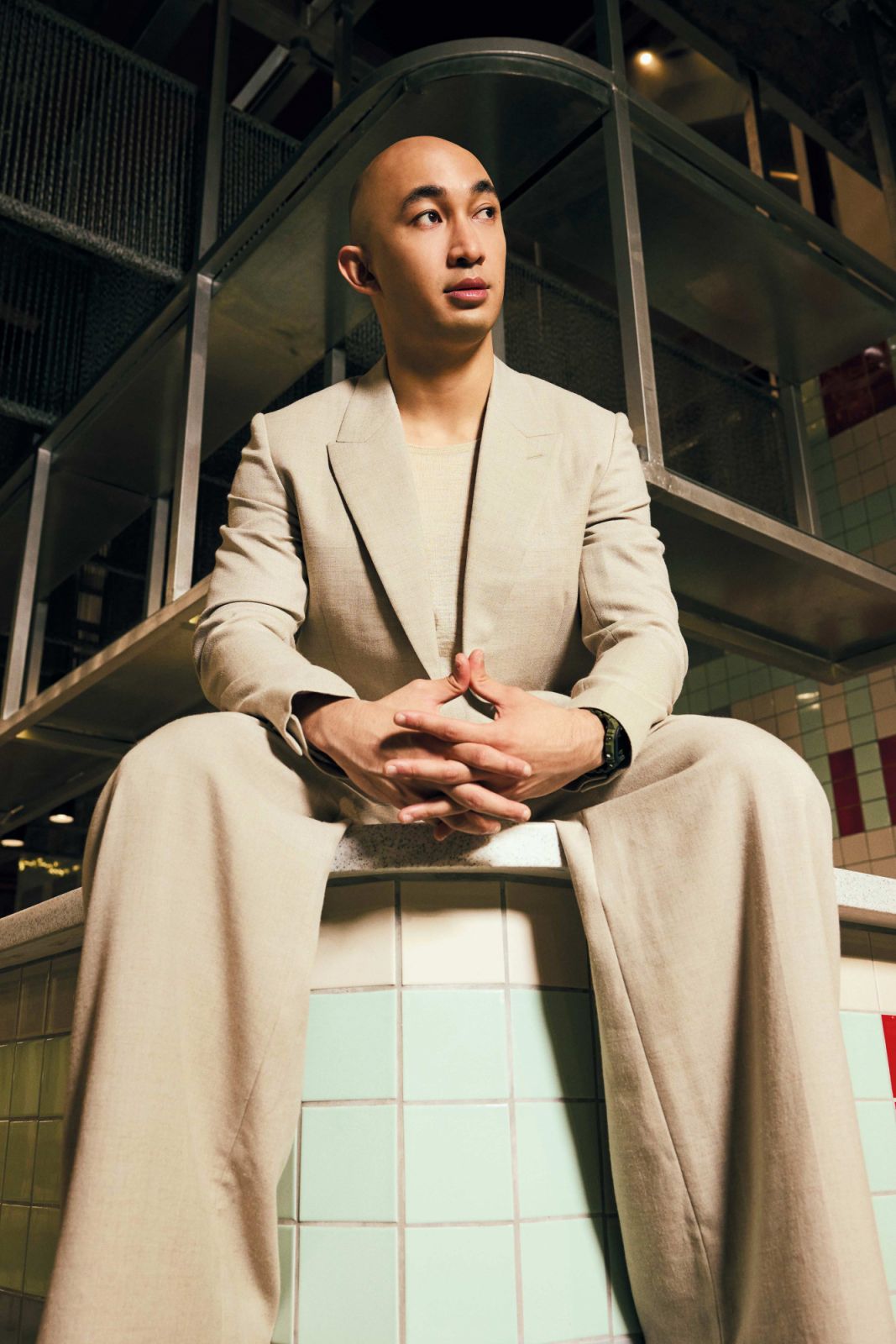 Dinesh Ratnam wears Dior blazer, tank top and trousers
