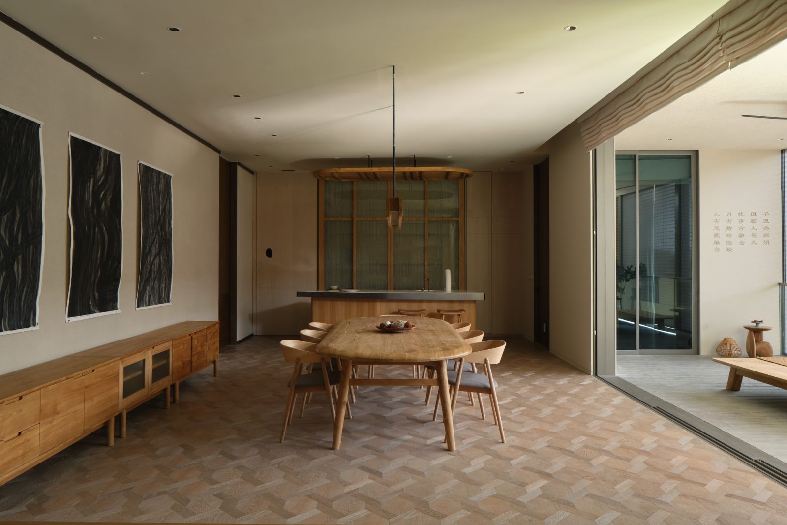 The customised furniture is paired with a bespoke 1.8m timber lighting fixture, AC2 dining chairs from Danish Design, and artworks from Jason Lim’s Under the Shadow of the Banyan Tree series