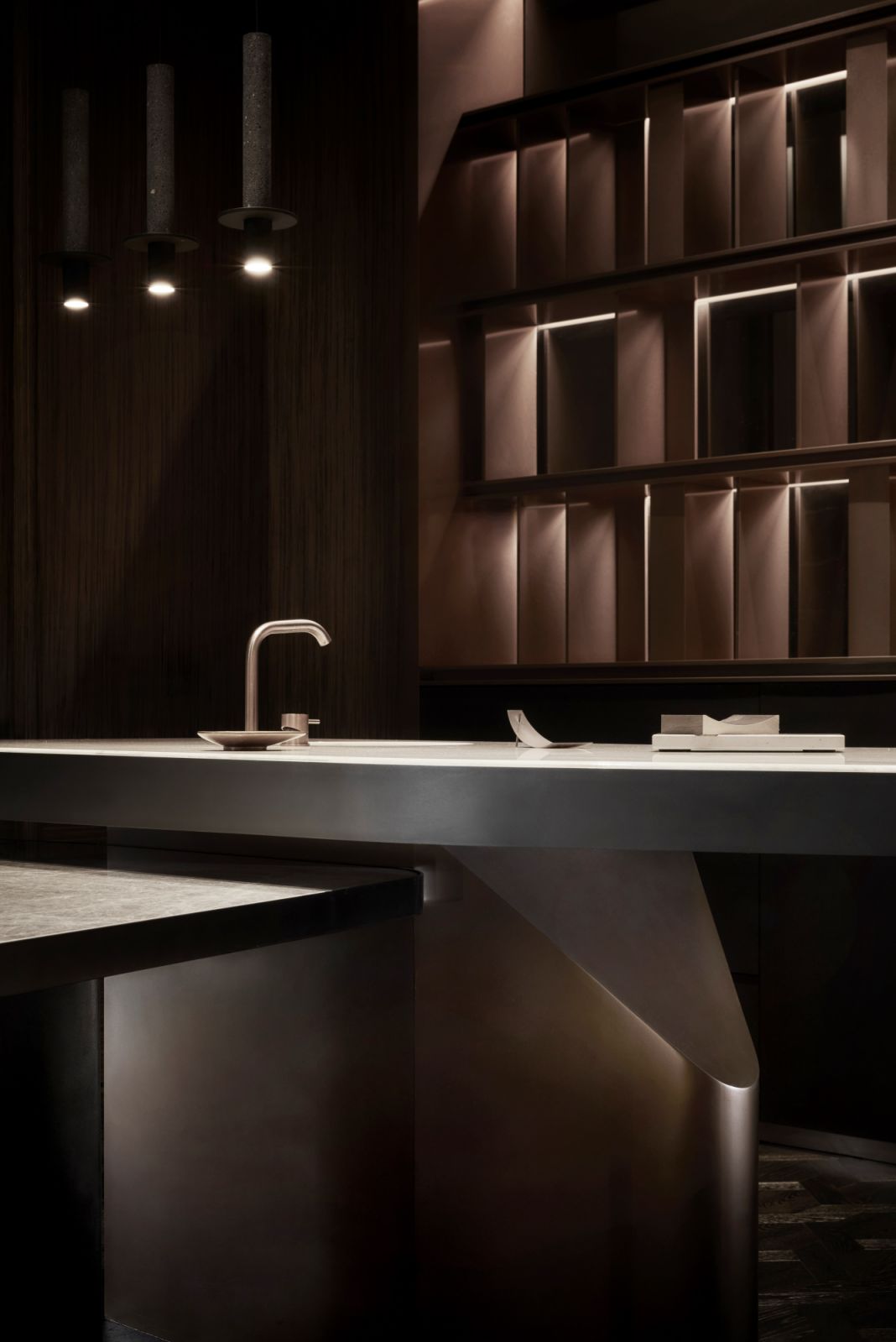 The detail of the kitchen island’s sculptural base
