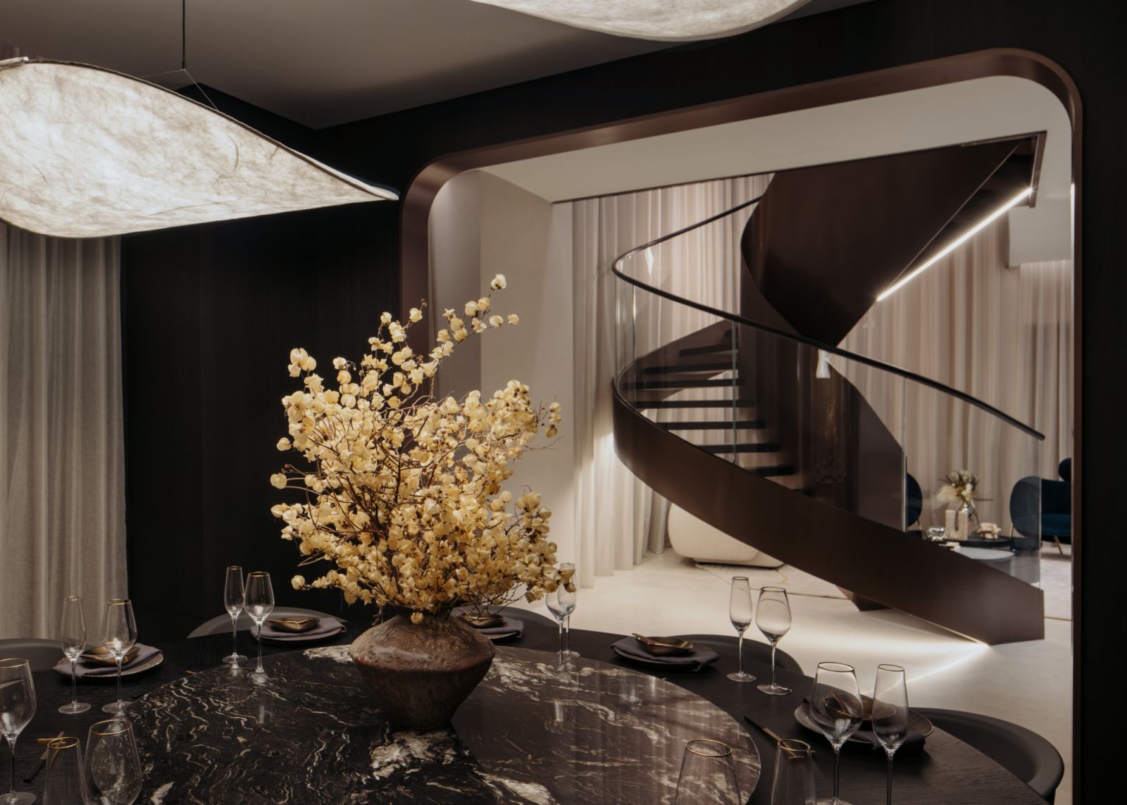 An elegant spiral staircase twists and connect various sections of the expansive 6,000 sq ft super penthouse