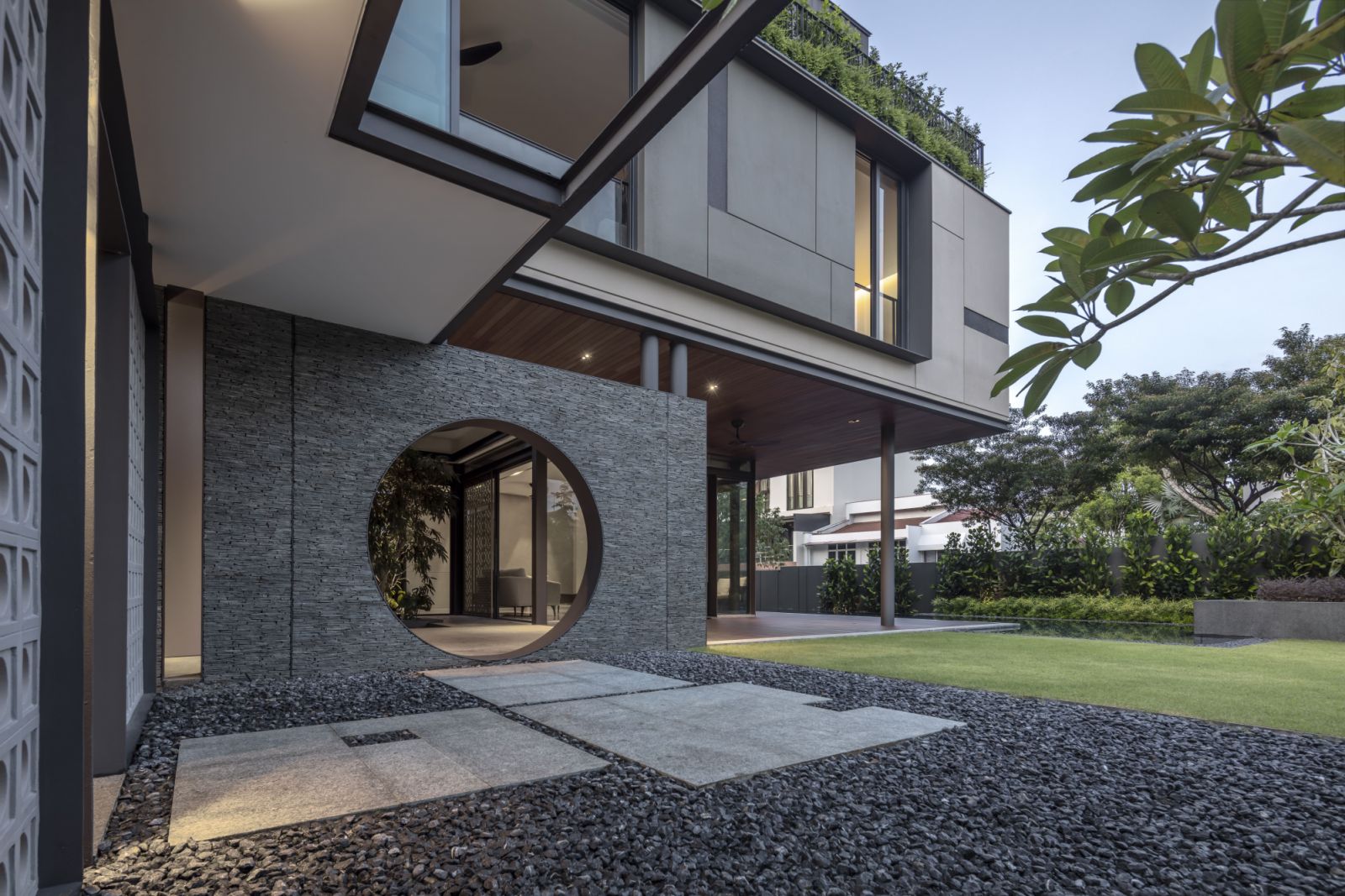 The geometric openings on solid planes lend a distinct look to the house