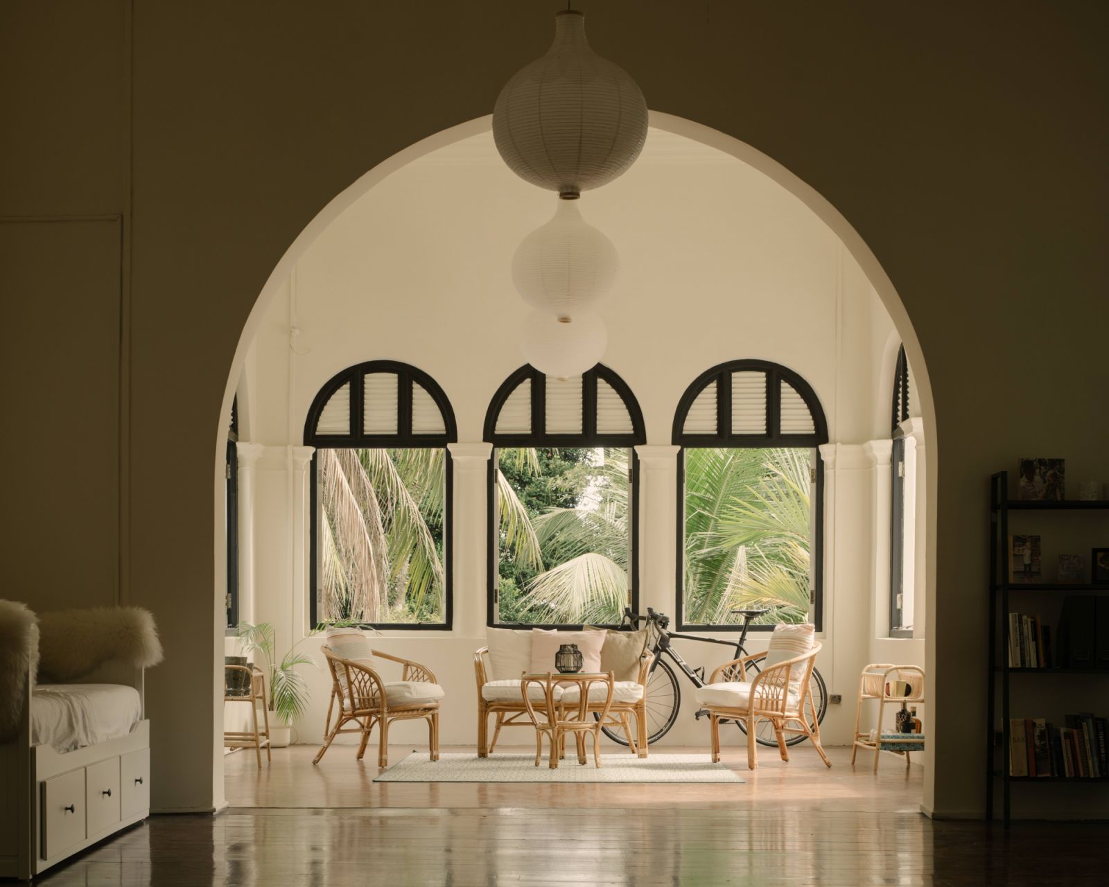 The Pender Road mansion's second level living room framed by archway
