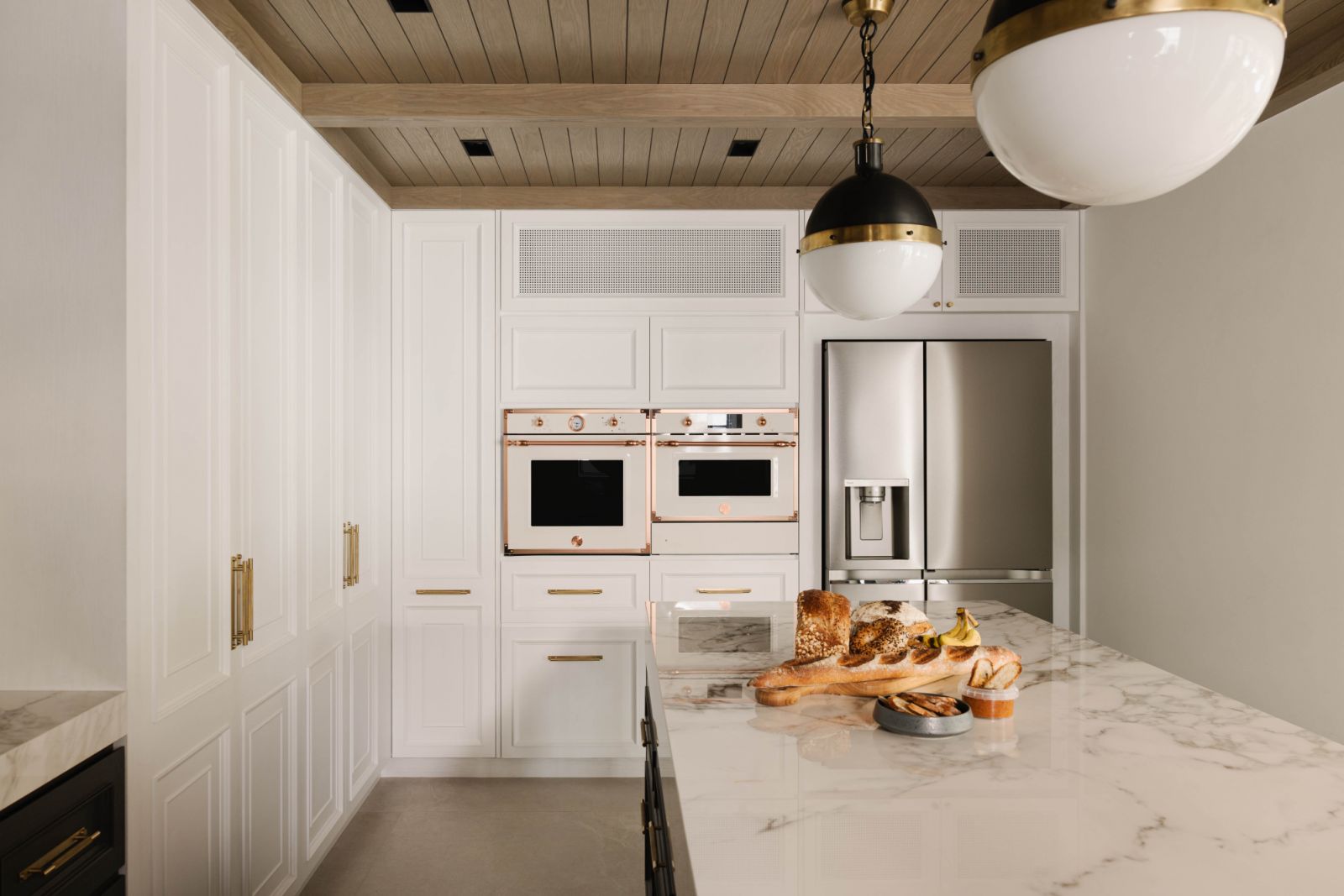 The kitchen island doubles as a stylish breakfast counter